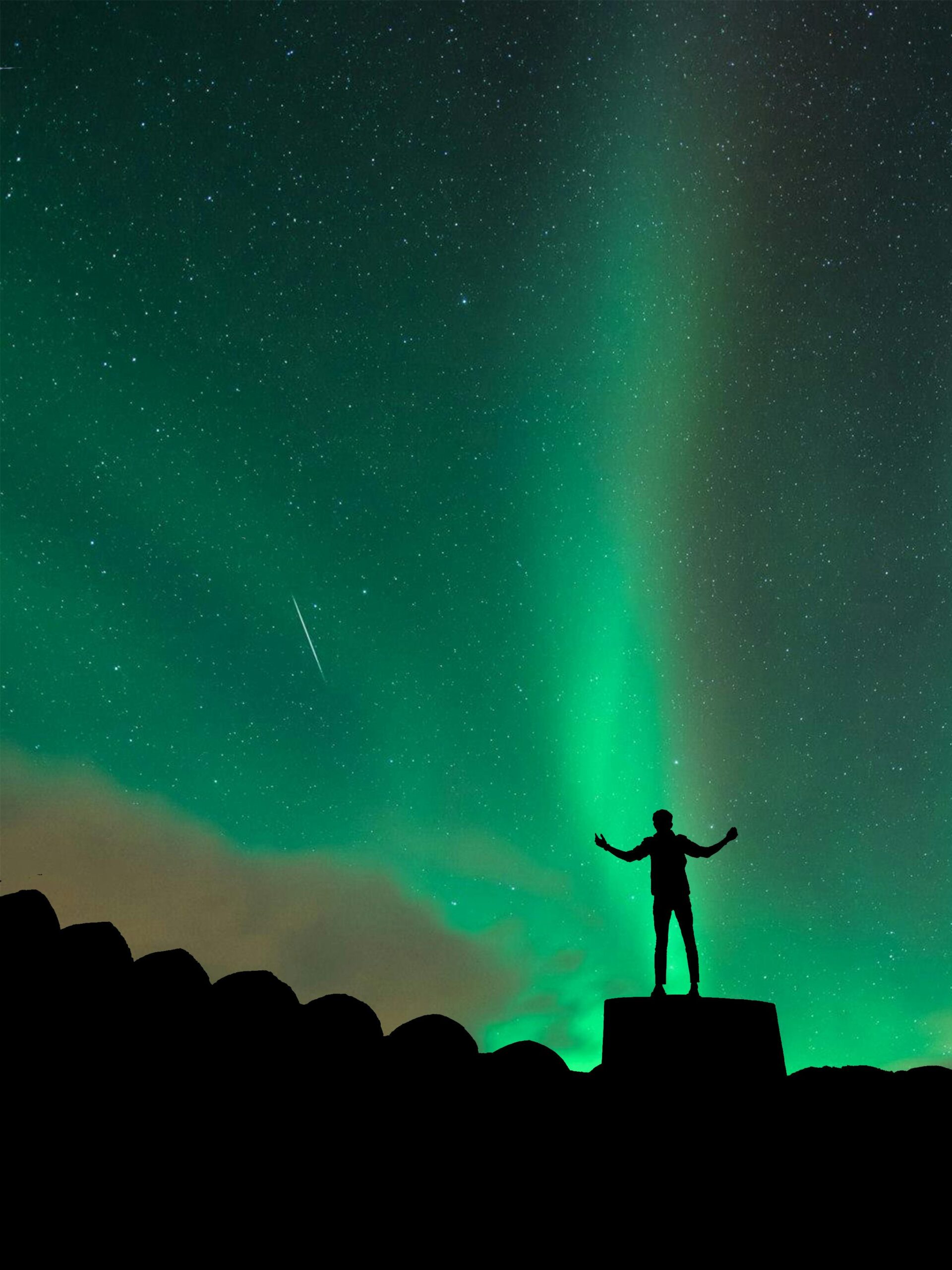 Silhouette Of Man Standing On Rock Under Starry Night