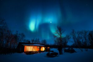 Brown Cottage Under Aurora Borealis