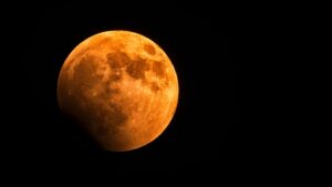 Beautiful capture of a blood moon seen from Rethymno, Greece against a dark sky.